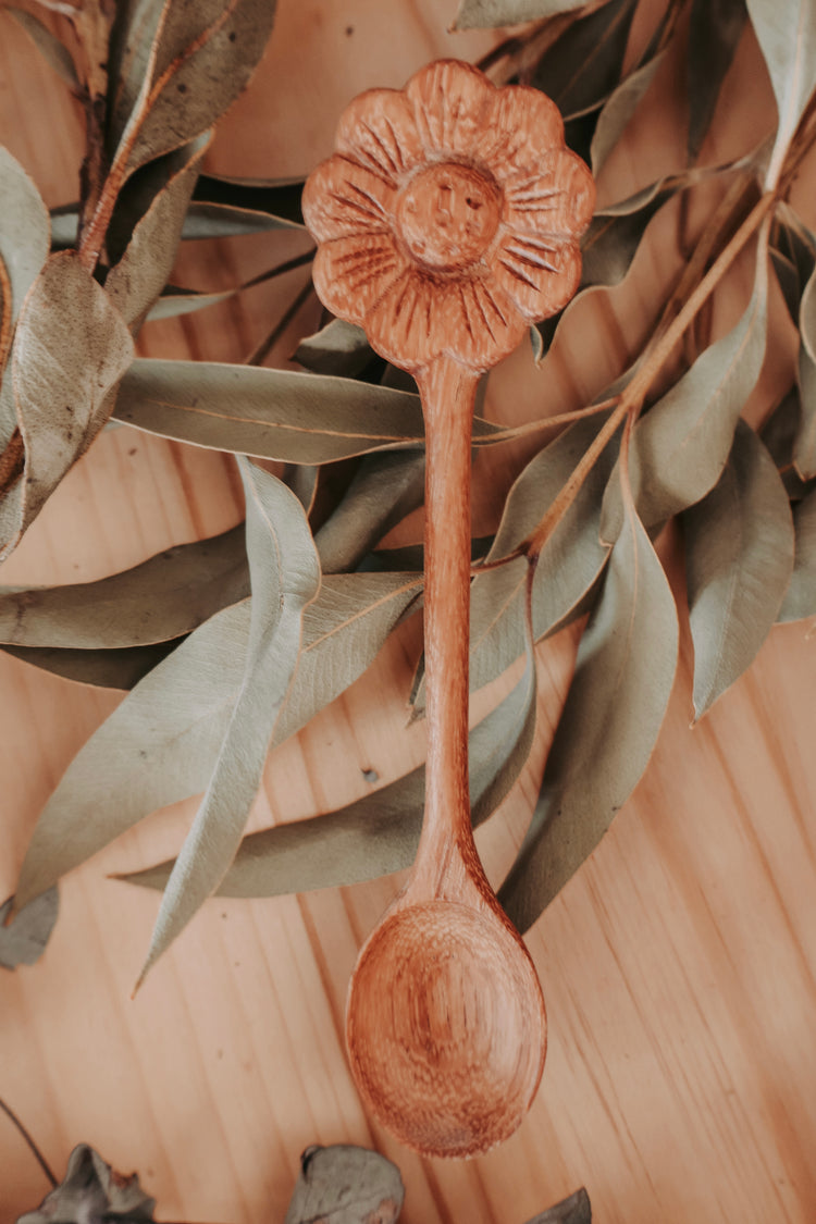 wooden hands carved daisy spoon 